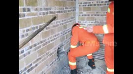 Firefighters cut free two-year-old trapped between two walls