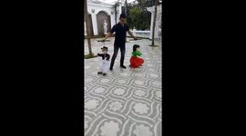 The man performed controls the puppets that dance to the music