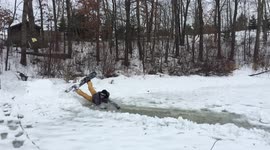 Snowboarder fails and crashes on water on ice.