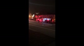 Fire trucks putting out fire in house on Glenashton Dr Oakville Ontario