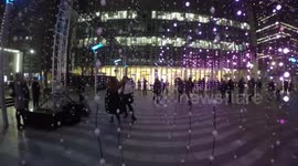 Two Women Dance in One Of The Winter Light Artworks In Canary Wharf