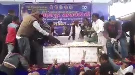 Political party workers go berserk to have a piece of cake to mark birthday of party leader in India