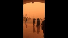 Shopper walks out of Cairo mall to find the sky an eerie orange
