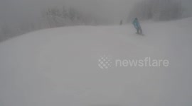 snowboarding down the mountain and falling