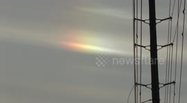 Cold weather in Toronto causes rainbow-like refraction in the sky