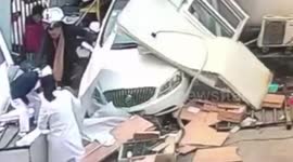 Car plunges through hospital portacabin injuring two patients