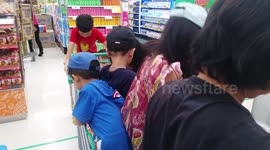 Family teamwork in the supermarket.