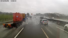 Lorry driver blinded by splash of water brakes on busy UK motorway