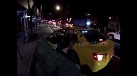 Touching moment cyclist helps an elderly stranger get out of New York taxi