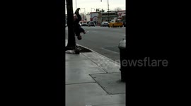 Brooklyn man plays flute while hanging UPSIDE DOWN from tree