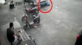 Lucky escape for toddler hit by truck while riding toy bike on roadside