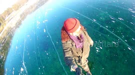 RAW FOOTAGE: Russian man films mesmerising walk across world's deepest frozen lake