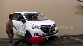 Minivan loses control and crashes into Indonesian river