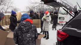 Volunteers in Toronto pack emergency supplies for the homeless during severe cold weather outbreak