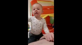 Toddler blowing belly raspberries