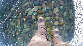 Russian man films mesmerising walk across ice on world's deepest lake