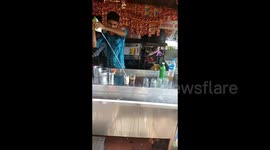 Ace Indian drink vendor uses flips and twists to mix local milk drink
