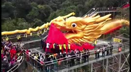 99-metre-long dragon dances on glass bridge to celebrate two world records having been created