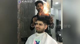 Indian barber has found an innovative way of cutting men's hair... by setting it on fire.