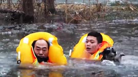 Elderly man who waded into icy river to rescue his dog gets trapped and has to be rescued