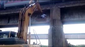 Locomotive pilot descends 50-feet in excavator after fixing train on bridge