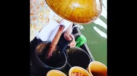 Floating Market  papaya salad vendor on baoat Bangkok
