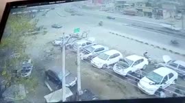 CCTV camera captures the moment a heavy truck loses its balance and topples over a car in Punjab, India