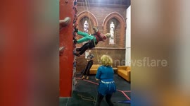 99-year-old grandmother scales 20 foot climbing wall in hopes of earning a world record