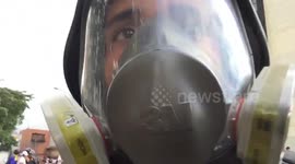 'They are chasing us!' Venezuelan journalist films moment he fled riot police on motorbike