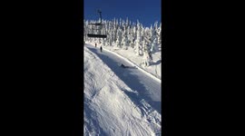 Lazy snowboarder takes the drag lift to a whole new level