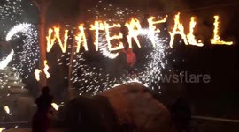 Fire-Dancers perform at the Waterfall Festival in Thailand