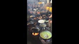 Master chef in Vietnam uses 12 pans to cook 5000 crepes a day at 'Crepe Temple'