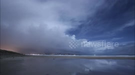 Moonlit Polar Air Snow Clouds Over Ocean - Time Lapse