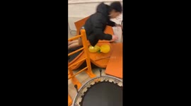 Girl tries to pop a balloon and fails