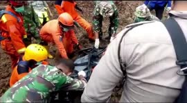 Search and rescue team evacuates a landslide casualty in South Sulawesi, Indonesia