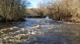 Swollen Yantic River roars through Uncas Historic District in Norwich, Connecticut