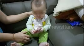 This adorable baby wants to bite everything infront of him