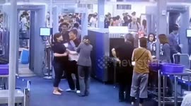 Angry tourist karate chops airport staffer at security check