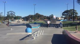 kid skateboards on a rail