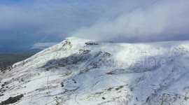 Aerial View of Winter Snowfall on N. Ireland Mountain