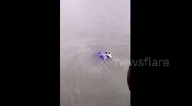 Good Samaritan rescues driver stuck in car sinking into a river