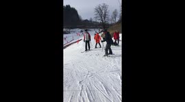 Man skiing then falls