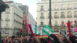 Taxi drivers protest with their hands up and singing in the center of Madrid, against Uber and Cabify