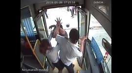 Bus driver fights road rage motorcyclist with help from colleague