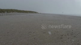 Snowing On Beach