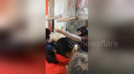 Crowds in China gather to buy traditional pastries for 'Little New Year' festival