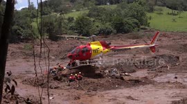 Brazil dam collapse: helicopter departs search site
