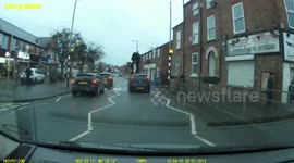 Car speeds through crossing, angry pedestrian