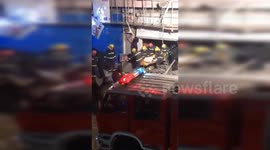 Emergency workers search hotel explosion aftermath in northern China