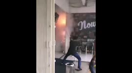 People fight short circuit fire in Indonesian town